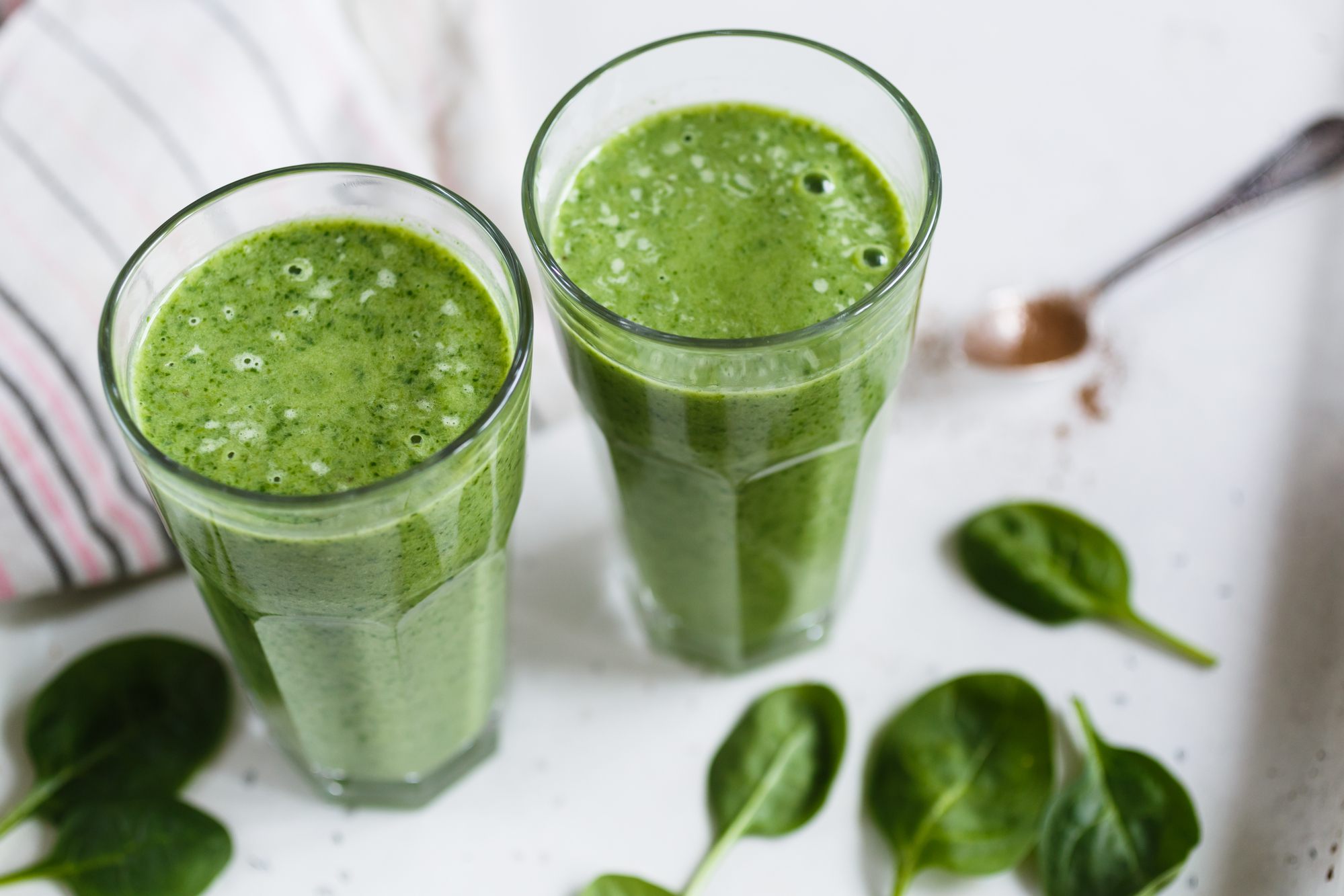 Two green smoothie in glasses